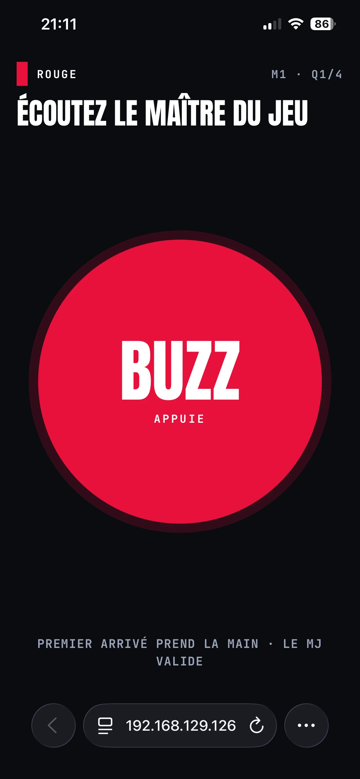 The red team’s phone says to listen to the host, with a large red BUZZ button.
